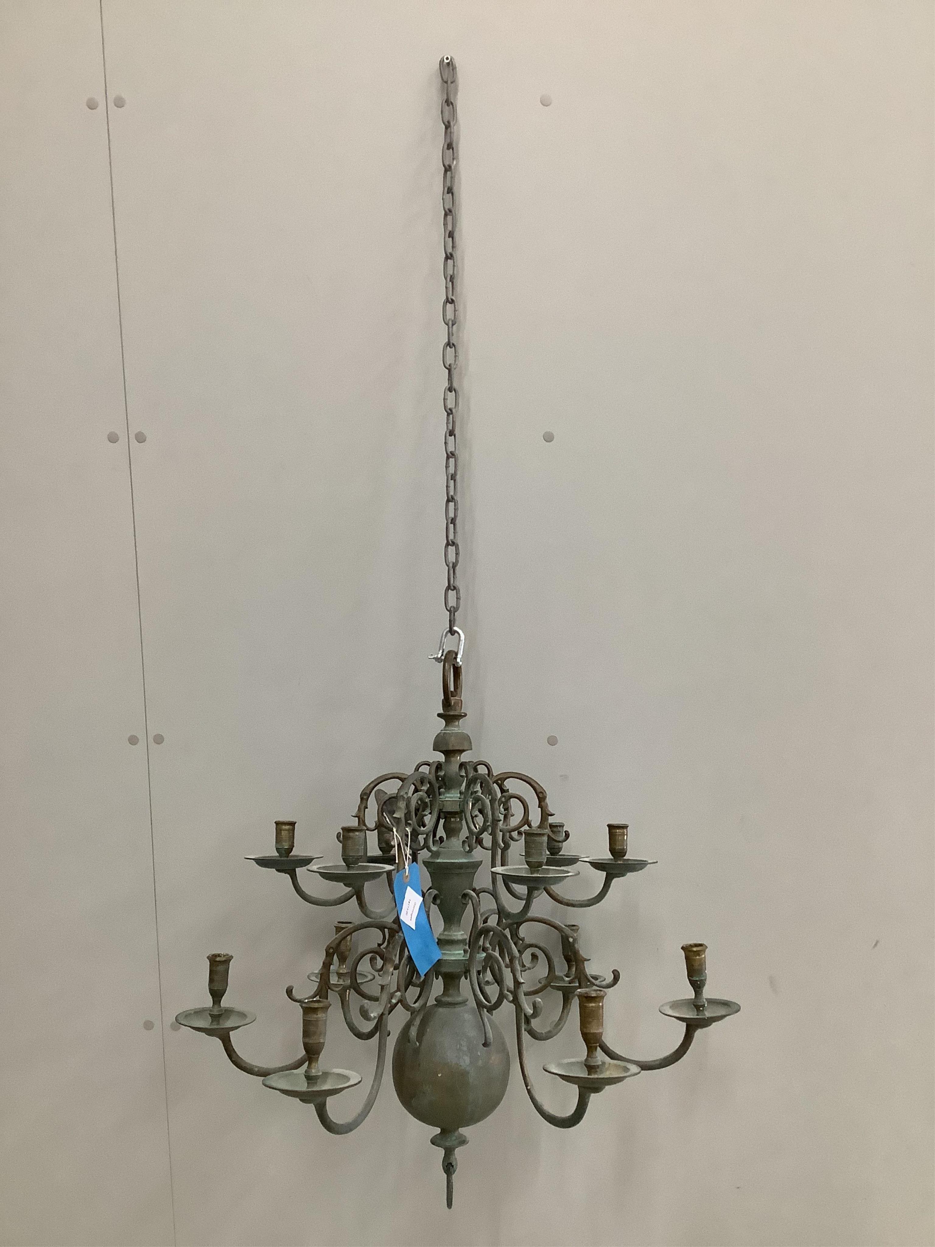 A Dutch twelve branch brass hanging candle holder, height 62cm. Condition - fair